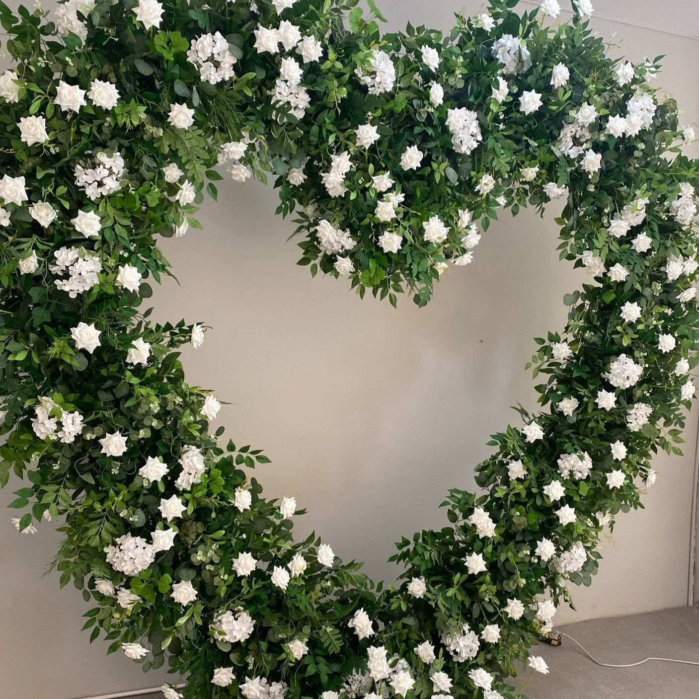 Foliage With White Florals Freestanding Heart With Stand